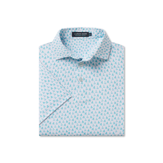 Folded light blue shirt with subtle pattern on a white background