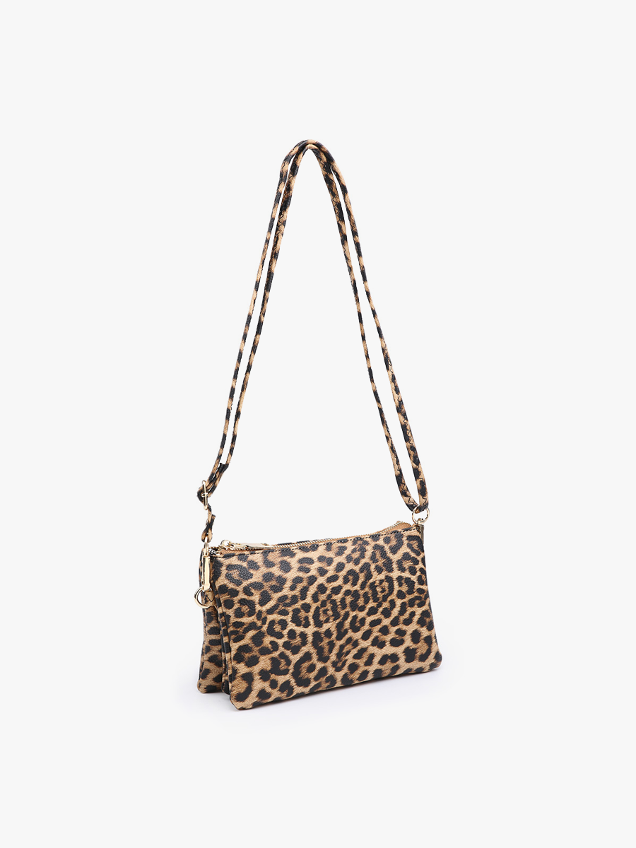 Leopard print handbag with a strap on a white background
