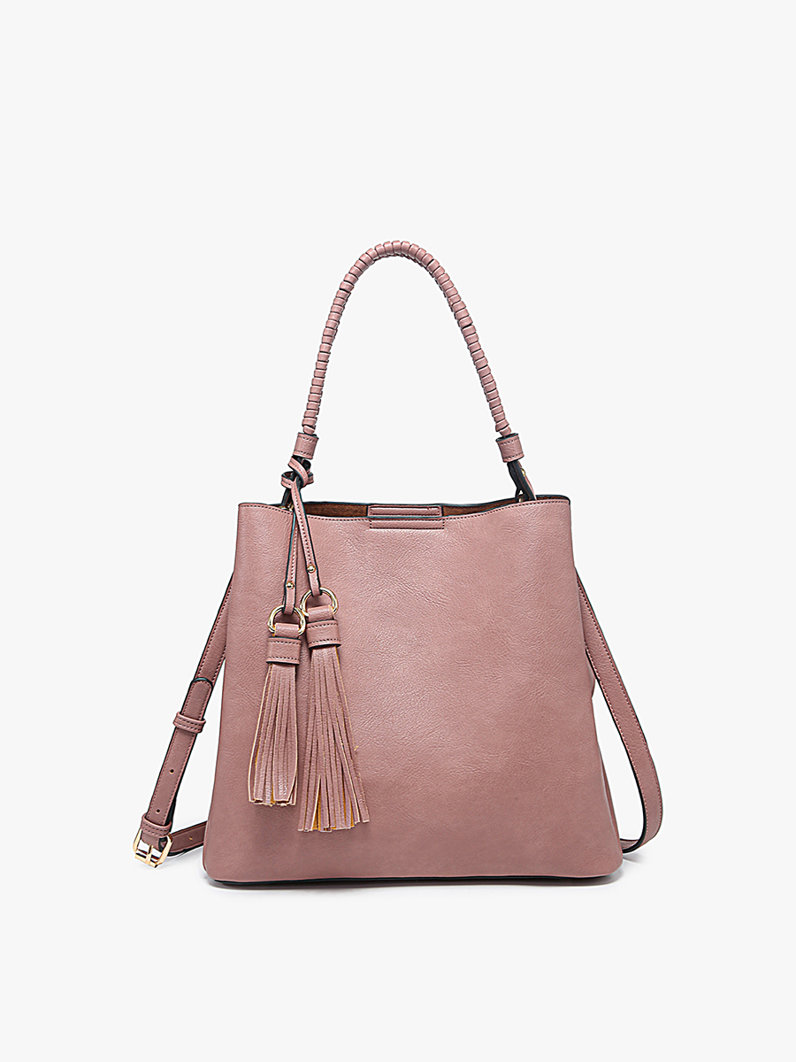 Pink handbag with tassels on a white background