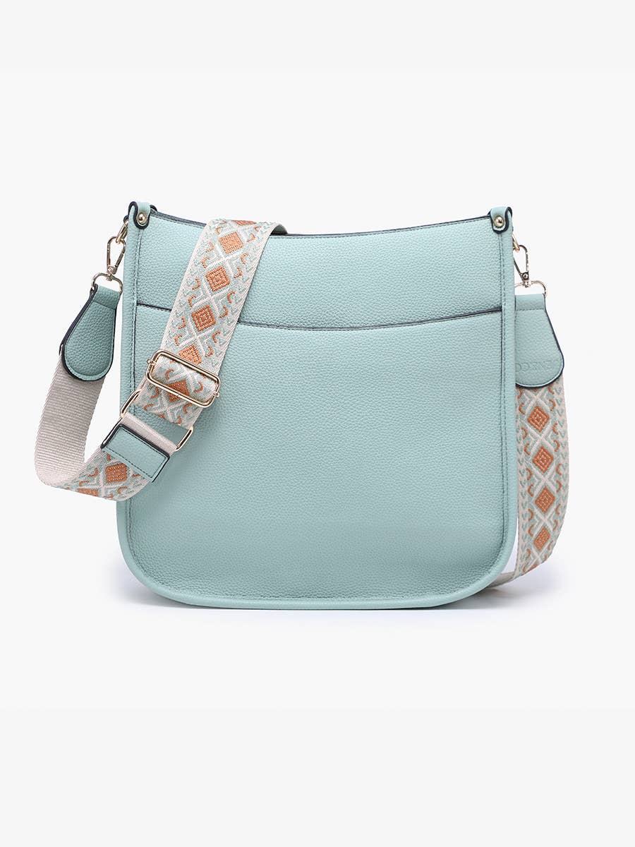 Light blue handbag with a patterned strap on a white background