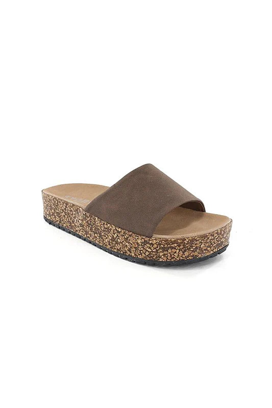 Brown sandal with cork sole on a white background