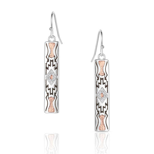 Pair of silver and rose gold earrings with geometric designs on a white background