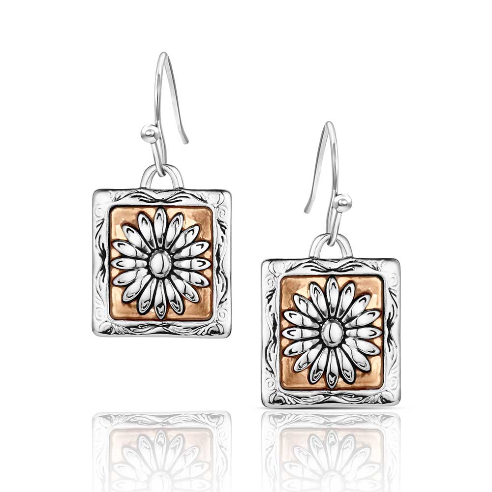 Pair of earrings with square design featuring floral patterns on a white background