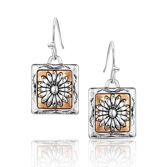 Pair of earrings with square design featuring floral patterns on a white background