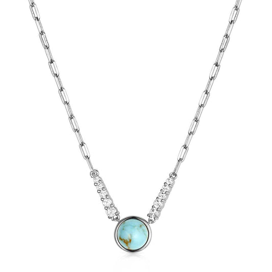 Necklace with a turquoise pendant and clear stones on a white background