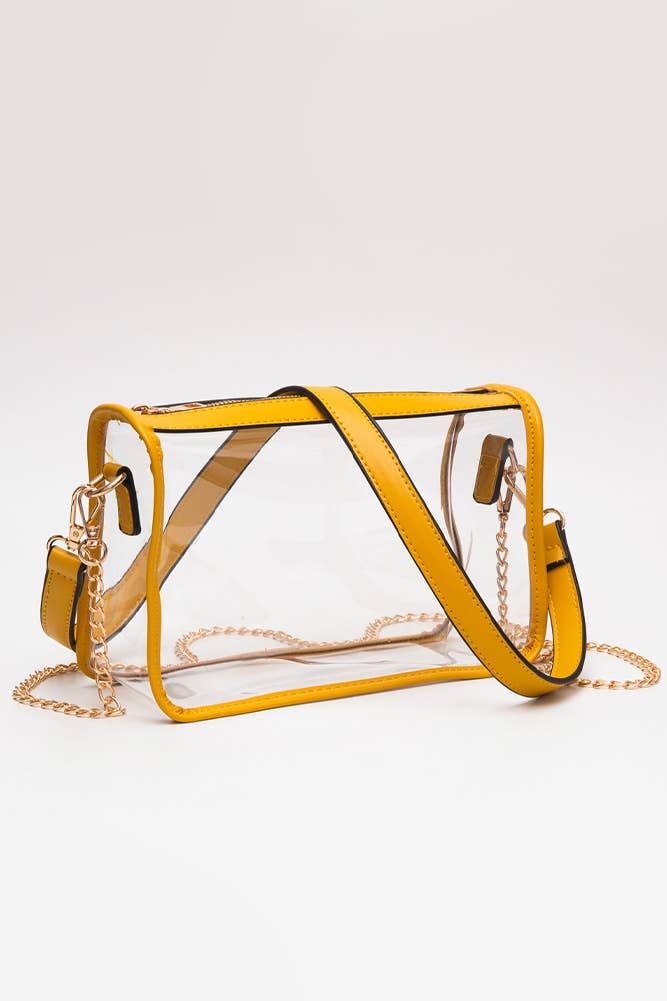 Yellow transparent handbag with gold chain strap on a white background