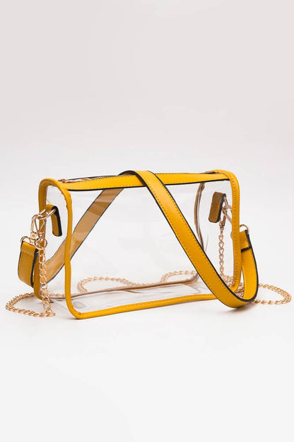 Yellow transparent handbag with gold chain strap on a white background