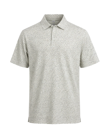 A short-sleeve polo shirt with a fine micro-pattern of small dark spots on a light beige or off-white base, presented on a clean white background.