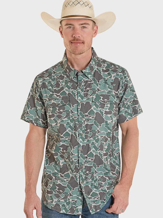 Man wearing a camouflage shirt and cowboy hat on a white background