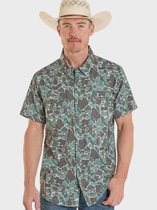 Man wearing a camouflage shirt and cowboy hat on a white background