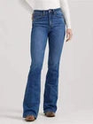 Woman wearing blue high-rise bootcut jeans with a white top and brown shoes