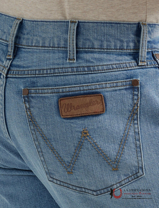 Close-up of Wrangler jeans pocket with brand logo.